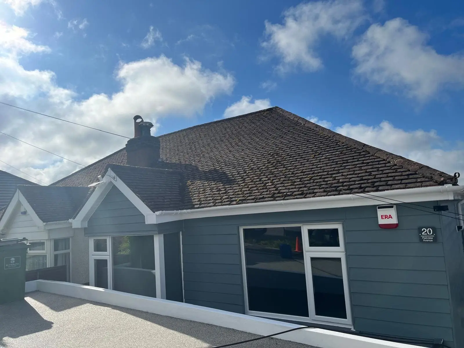 Mossy bungalow roof before professional cleaning in Plymouth, Devon