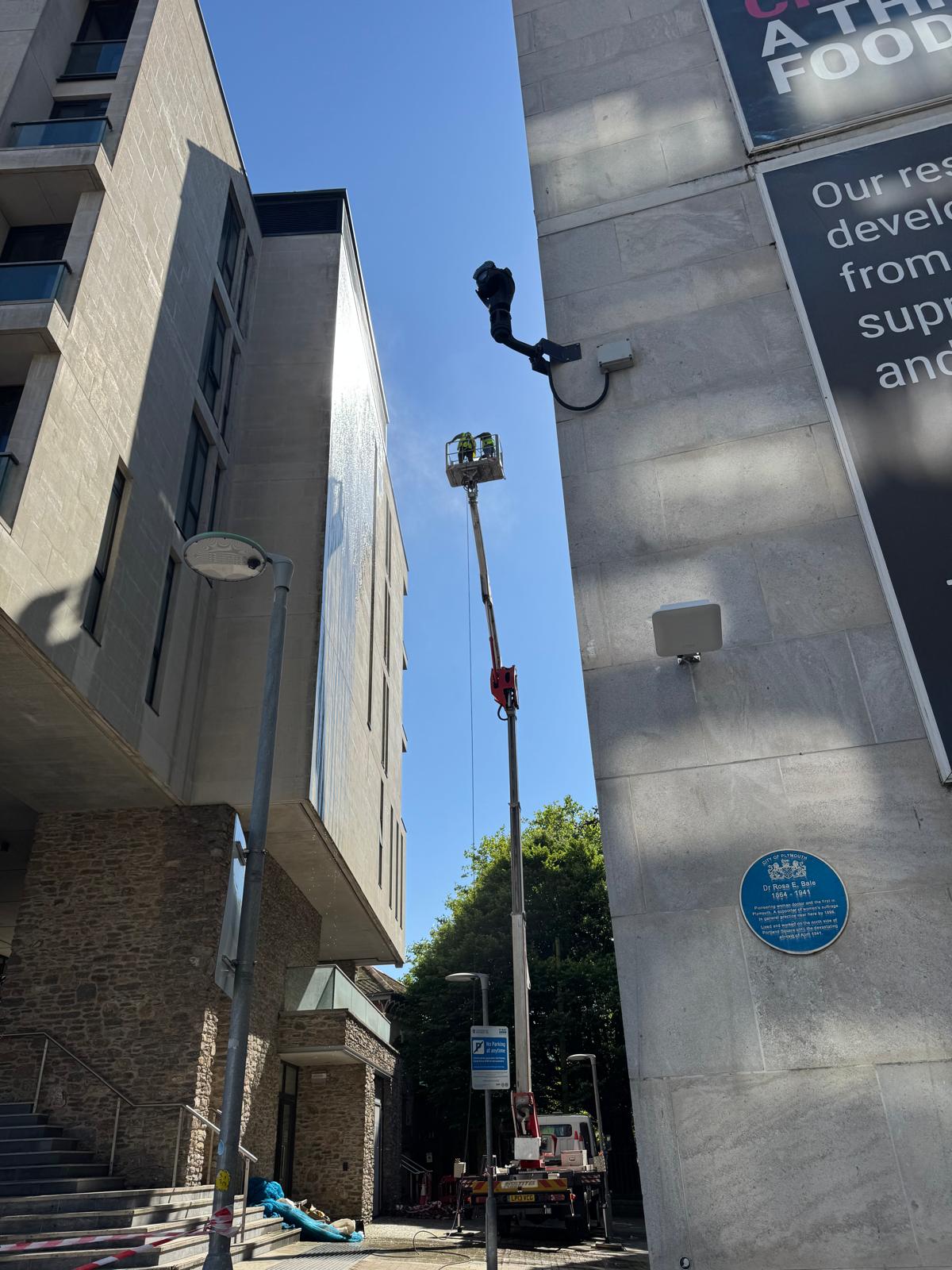 Cherry picker close-up during high-level cleaning work