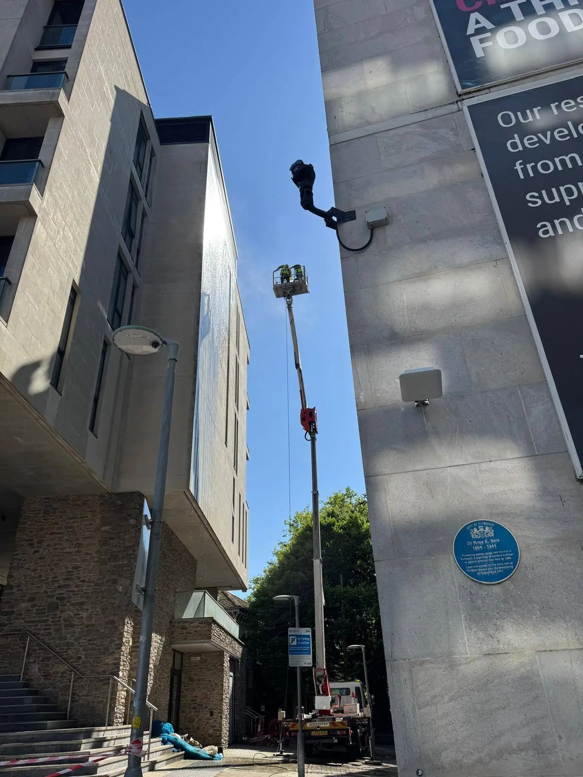 Cherry picker access equipment for high-level commercial exterior cleaning