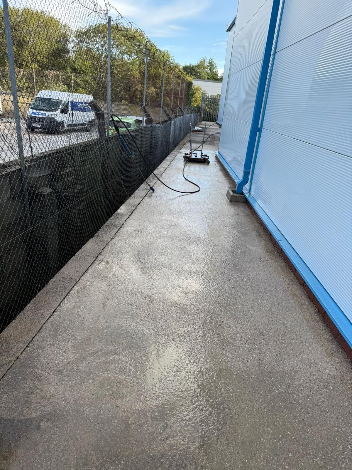 Pathway cleaning in progress at commercial premises