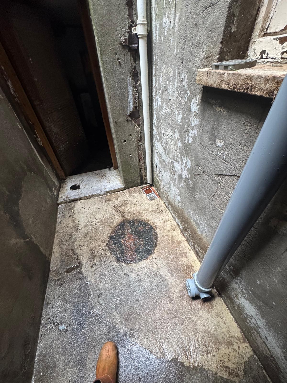 Drain area pressure washed and cleared of debris