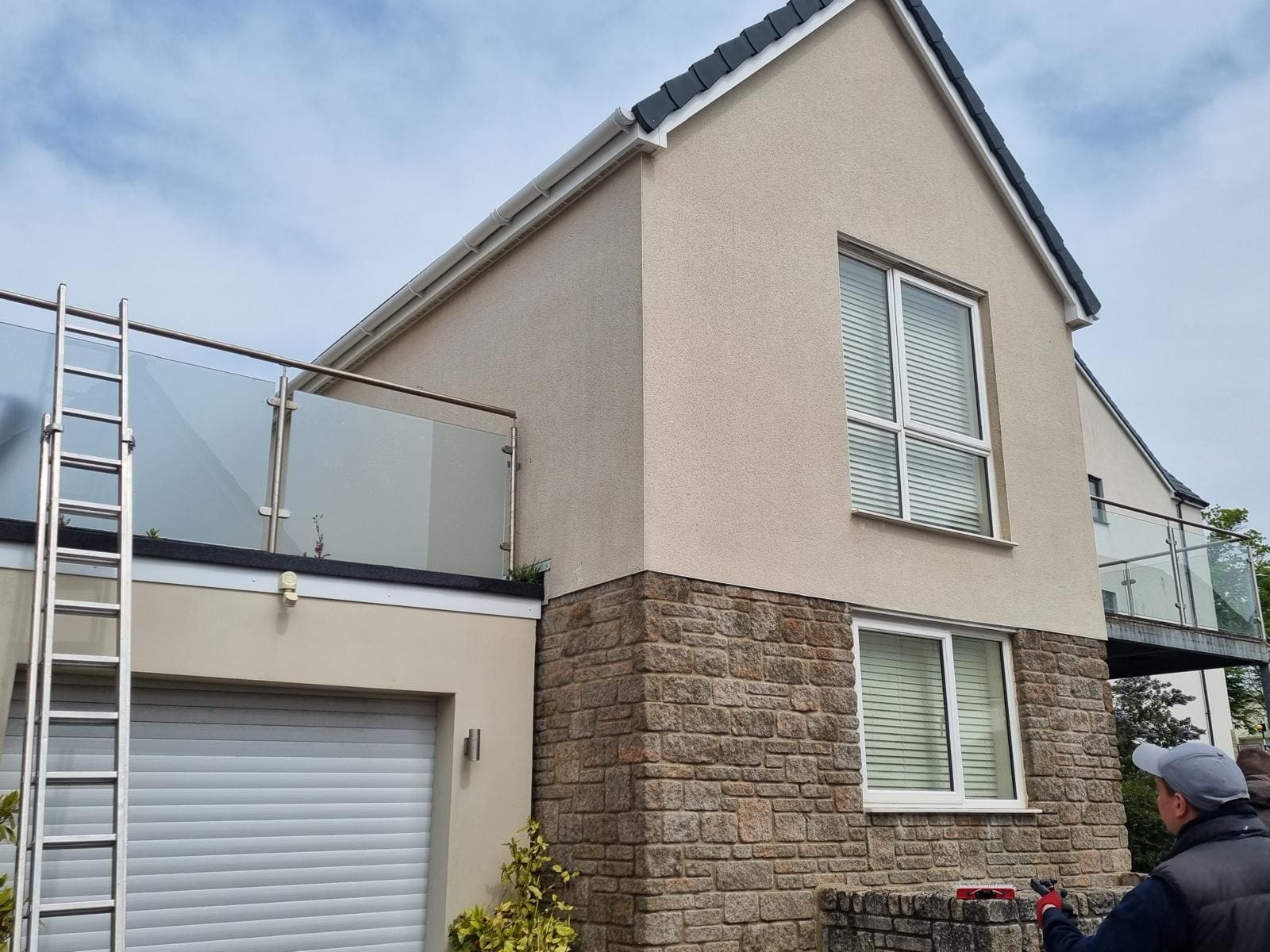 Render cleaned and restored showing bright white finish