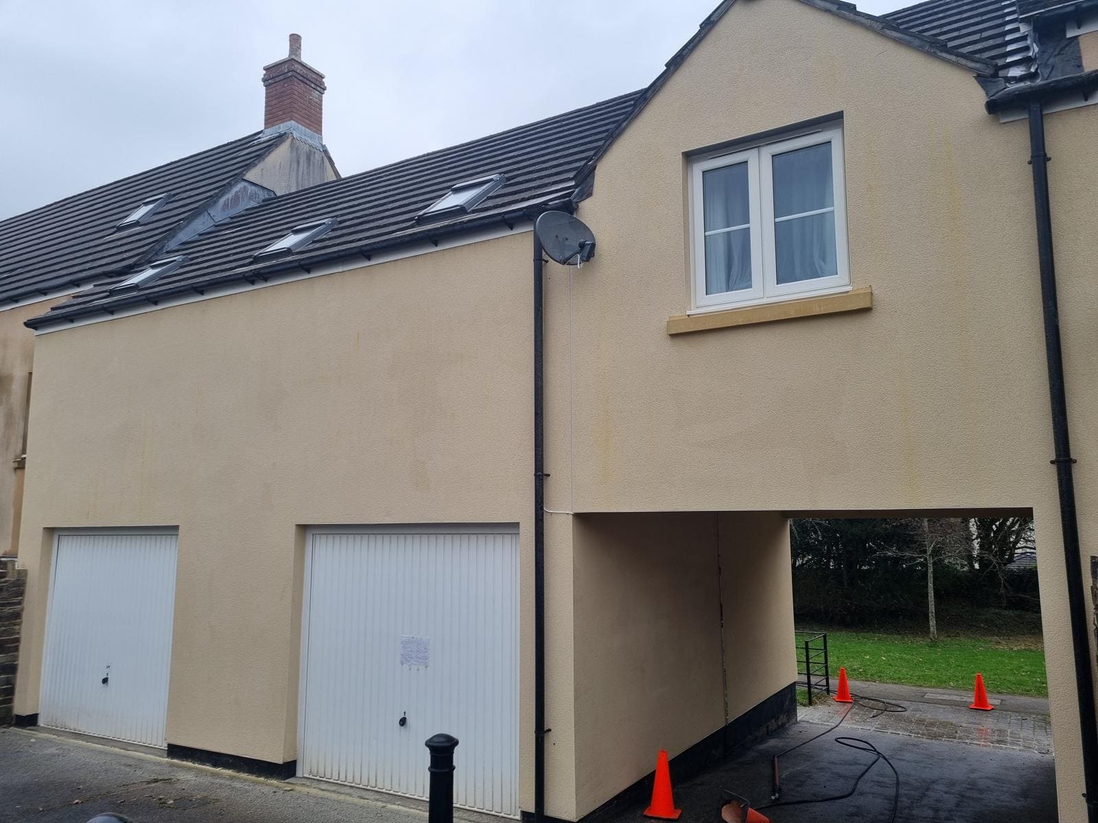 Rendered wall after softwash showing clean bright surface