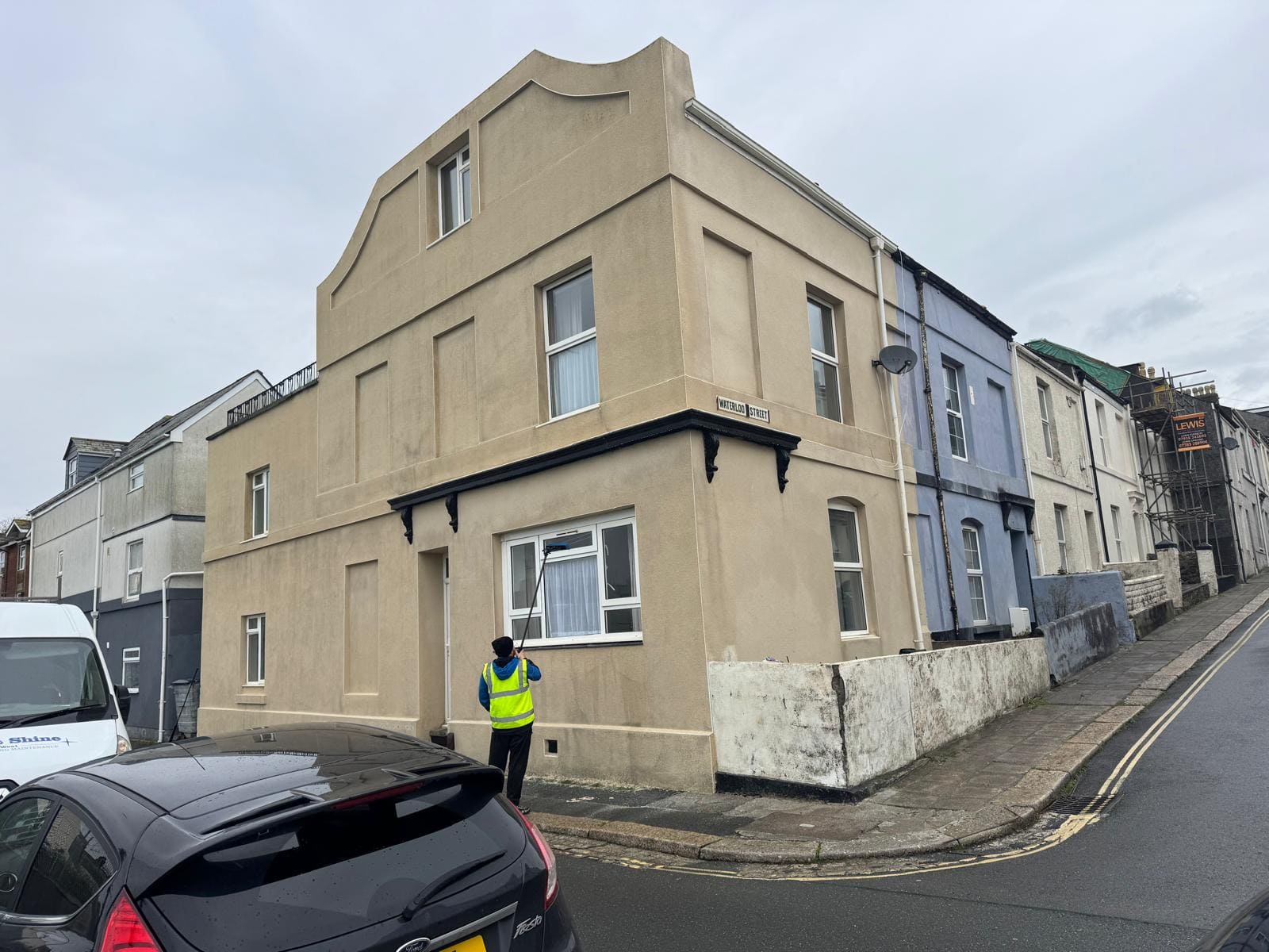 Same render wall after softwash treatment — clean and protected